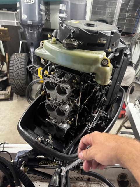 Outboard carburetor work